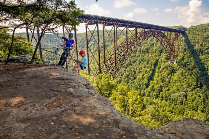 Two females rock climb in West Virginia